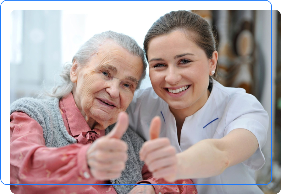 A woman and an old lady giving thumbs up.