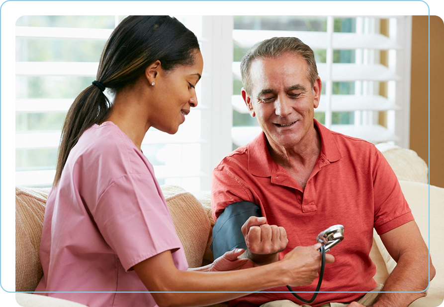 A woman is taking blood pressure of an older man.