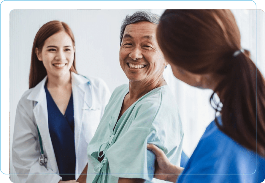 A group of doctors and nurses are smiling.