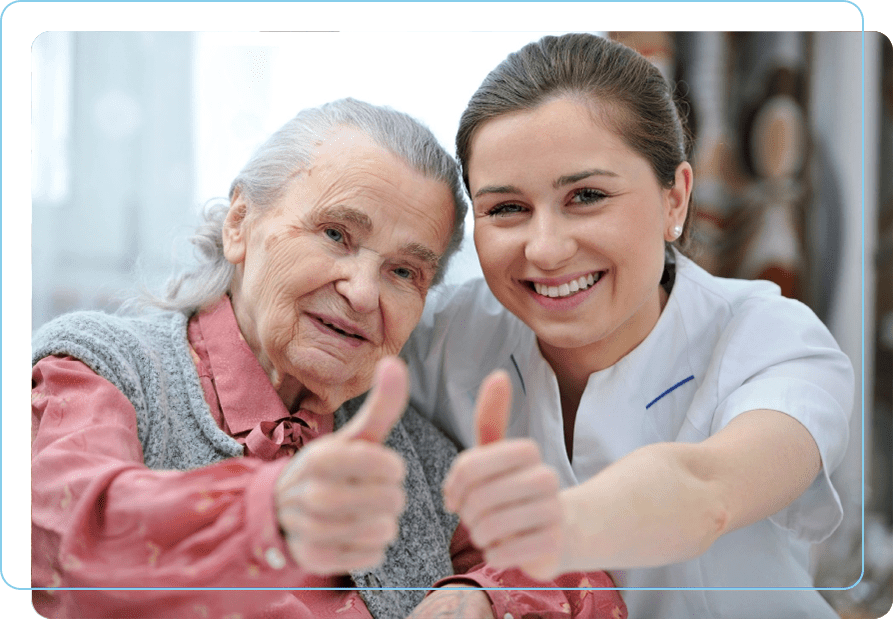 A woman and an old lady giving thumbs up