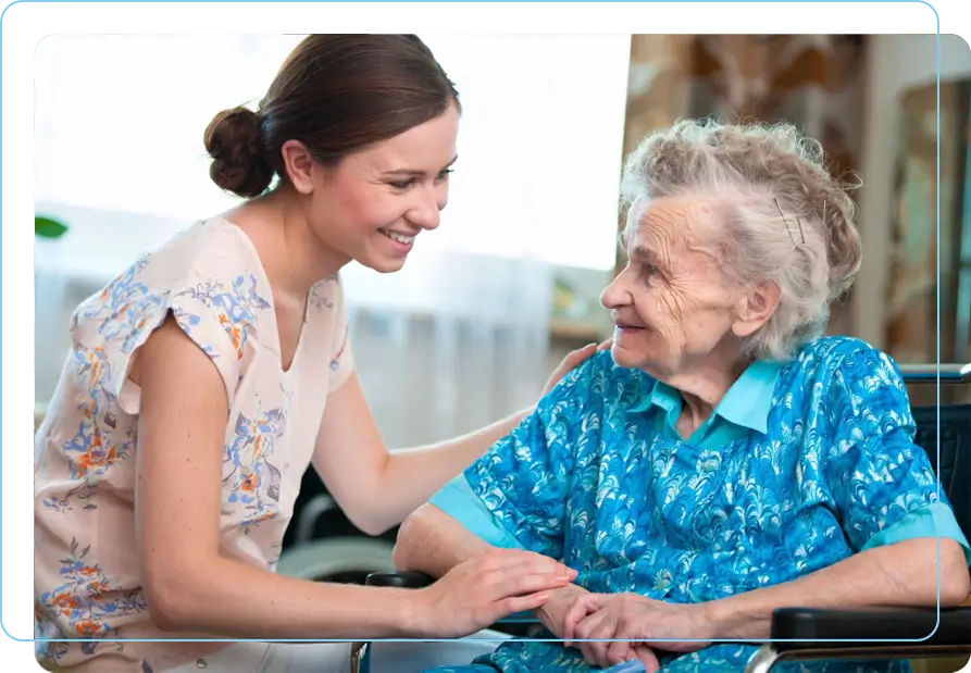 A woman and an old lady smiling for the camera.